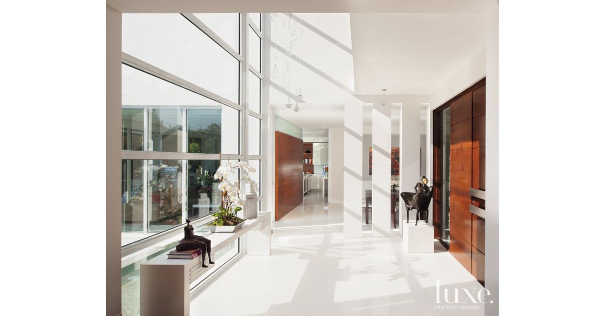 Modern High Ceiling Entry Foyer - Luxe Interiors + Design