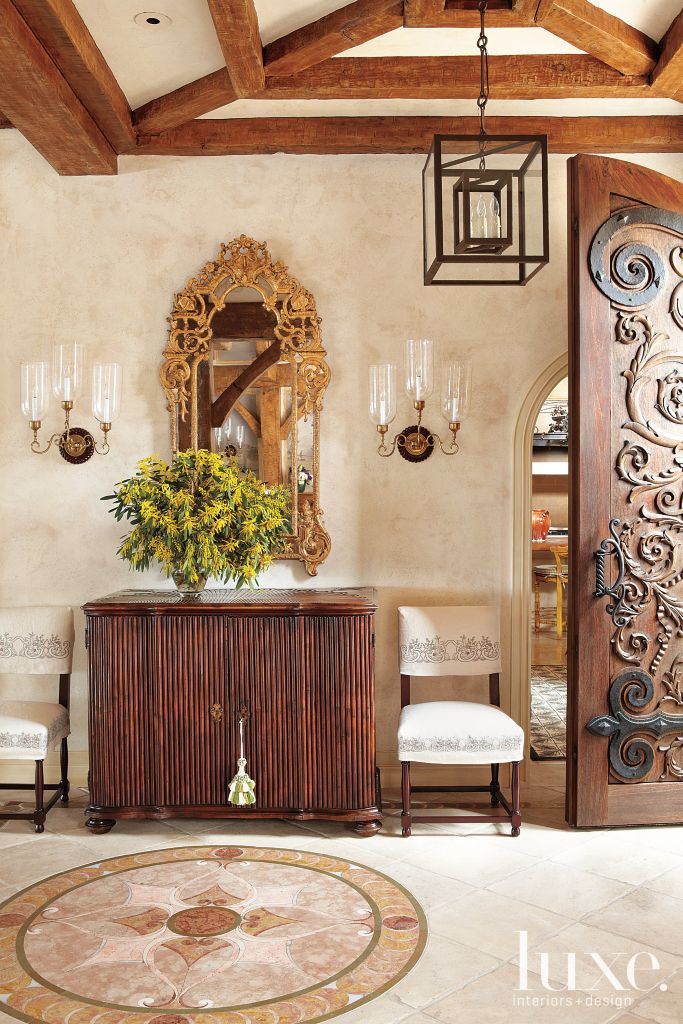 Mediterranean foyer with wooden console luxe interiors design