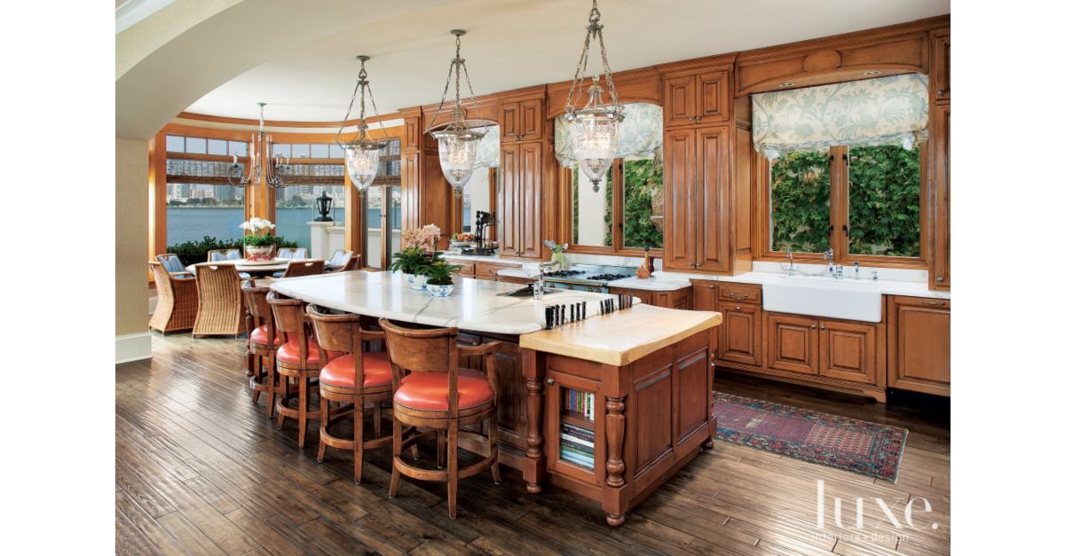 Traditional Kitchen with Orange Stools Luxe Interiors + Design