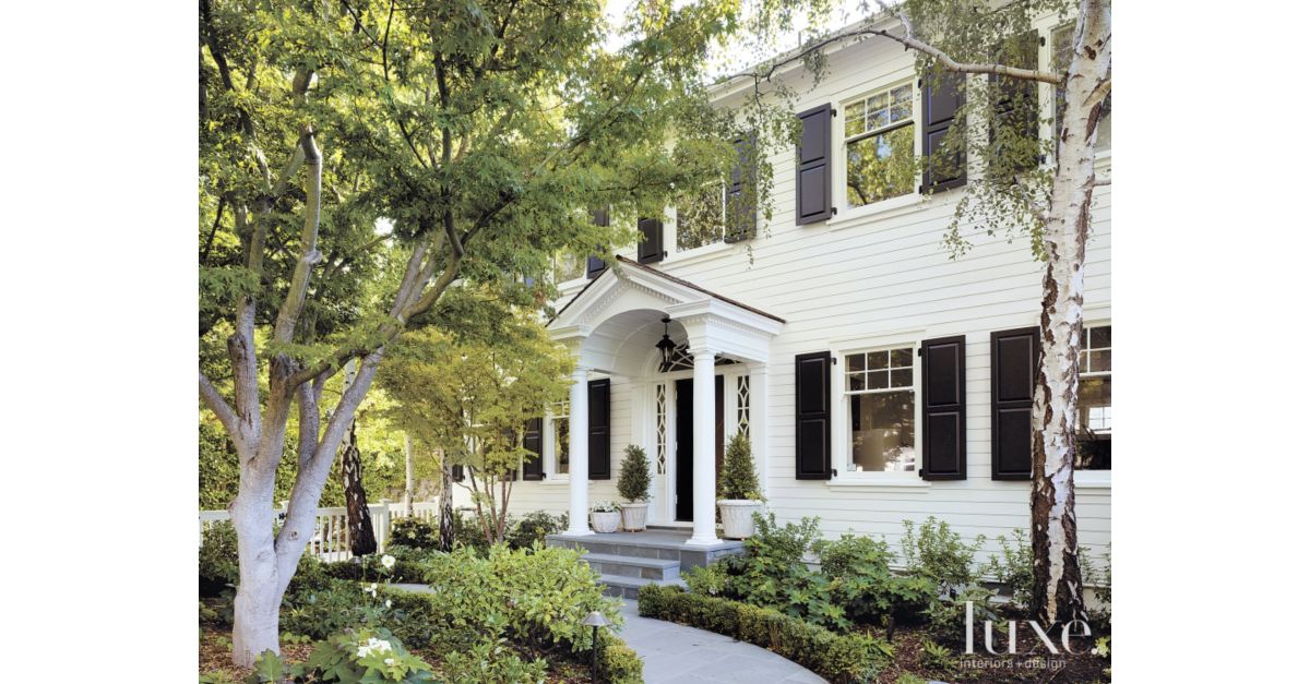 white dutch colonial revival exterior - luxe interiors