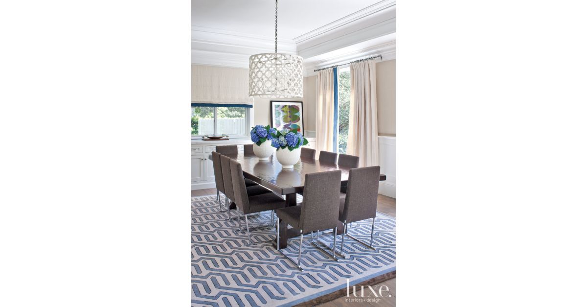 Contemporary White Dining Room with Blue Patterned Rug ...