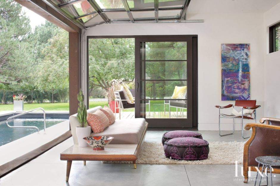 modern pool house with garage door - luxe interiors + design