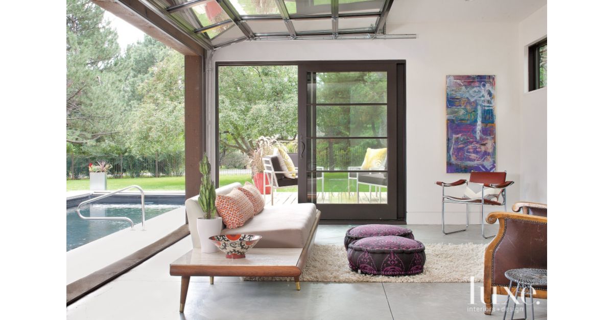modern pool house with garage door - luxe interiors + design