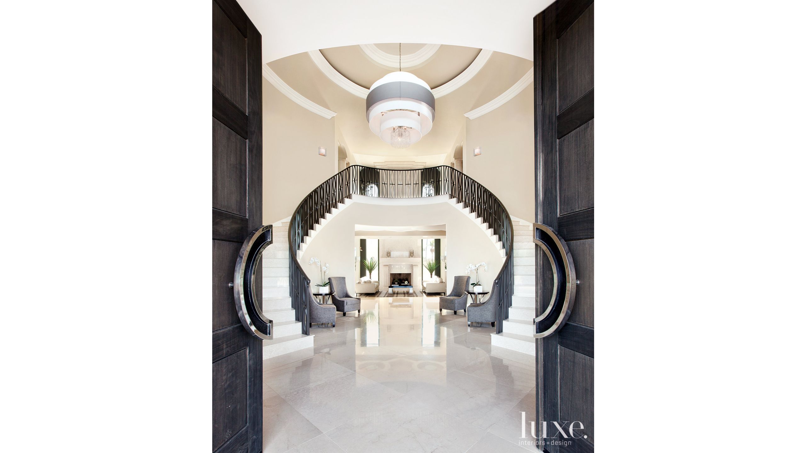 Contemporary White Entry With Double Staircase Luxe Interiors