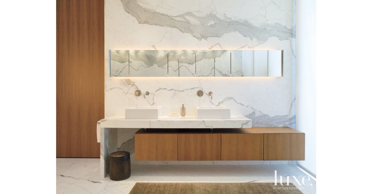 Walnut cabinetry in master bathroom - Luxe Interiors + Design