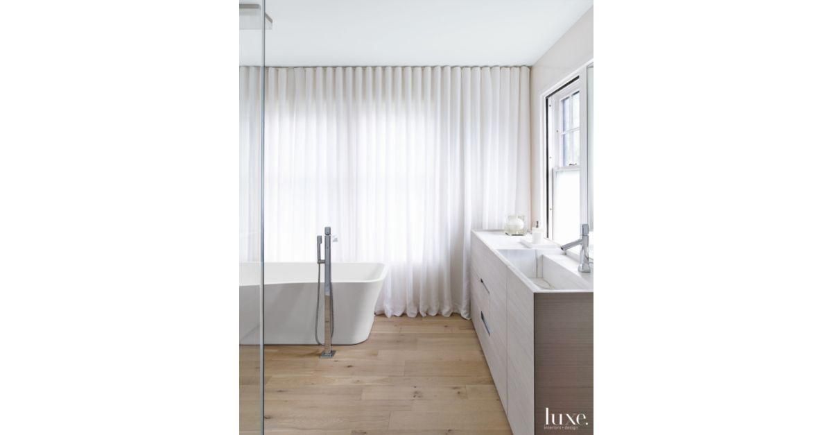 Modern White Bathroom with Oak Flooring - Luxe Interiors + Design