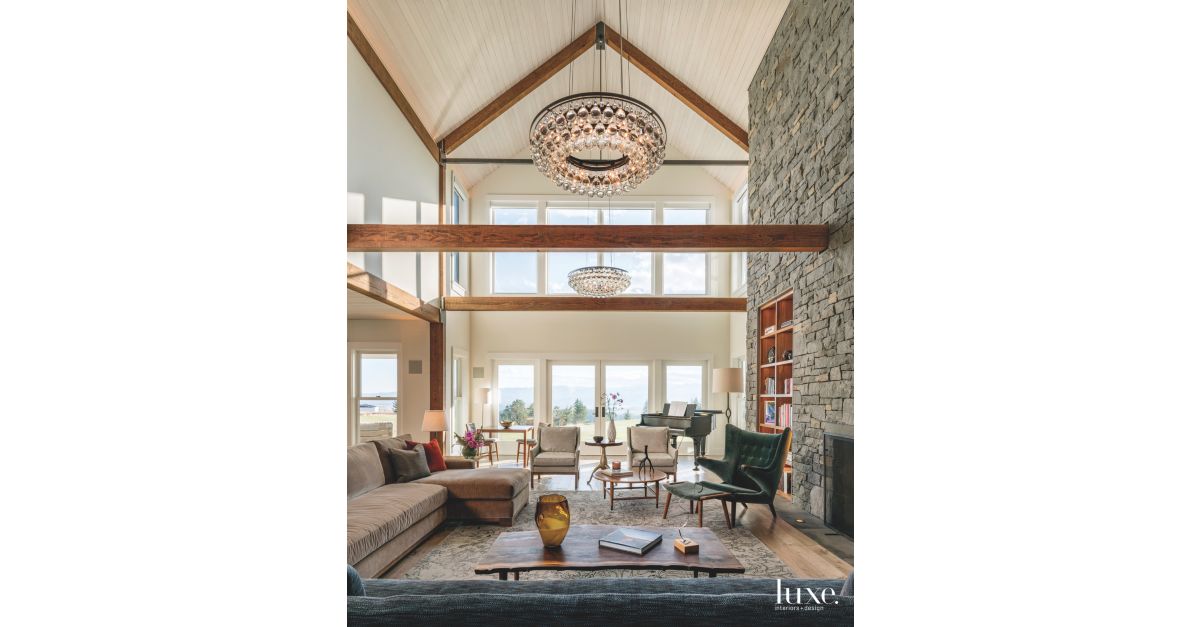 High Ceiling Stone Fireplace Great Room with Chandelier ...