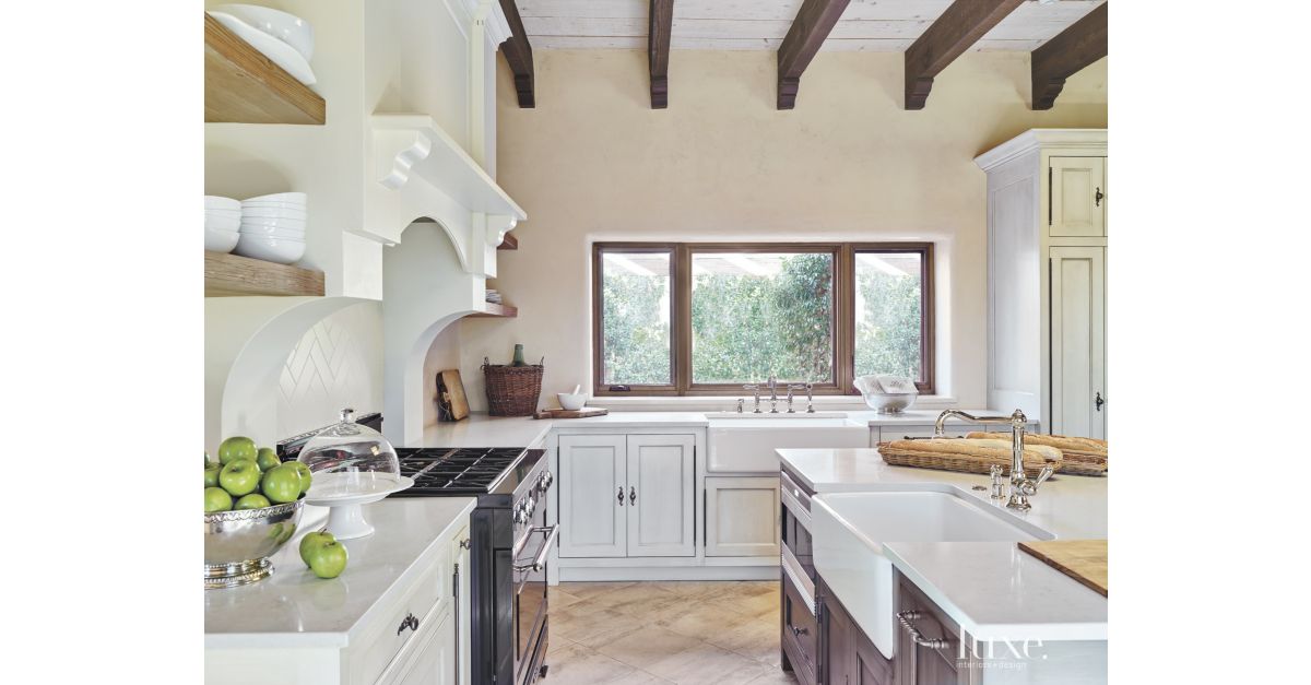 Mediterranean Cream Kitchen with Farmhouse Sinks - Luxe Interiors + Design