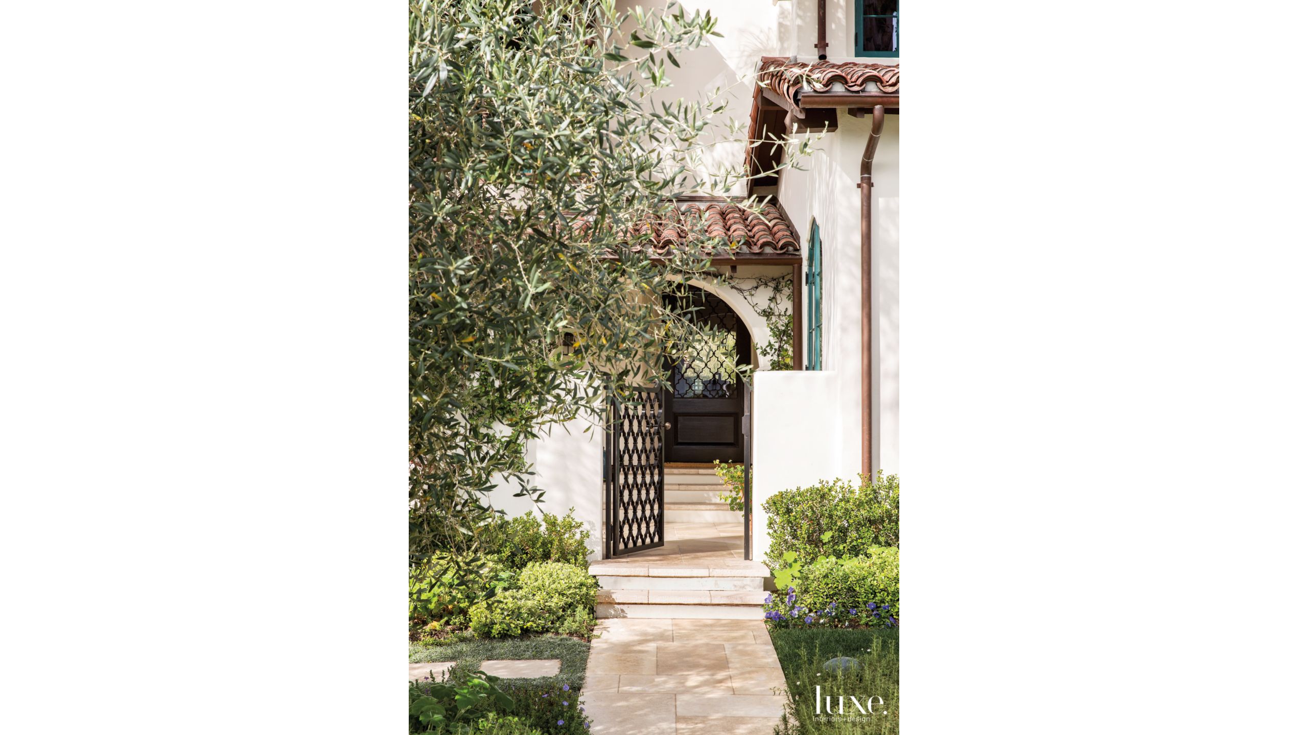 Traditional Cream Entry With Arched Doorway And Olive Tree Luxe