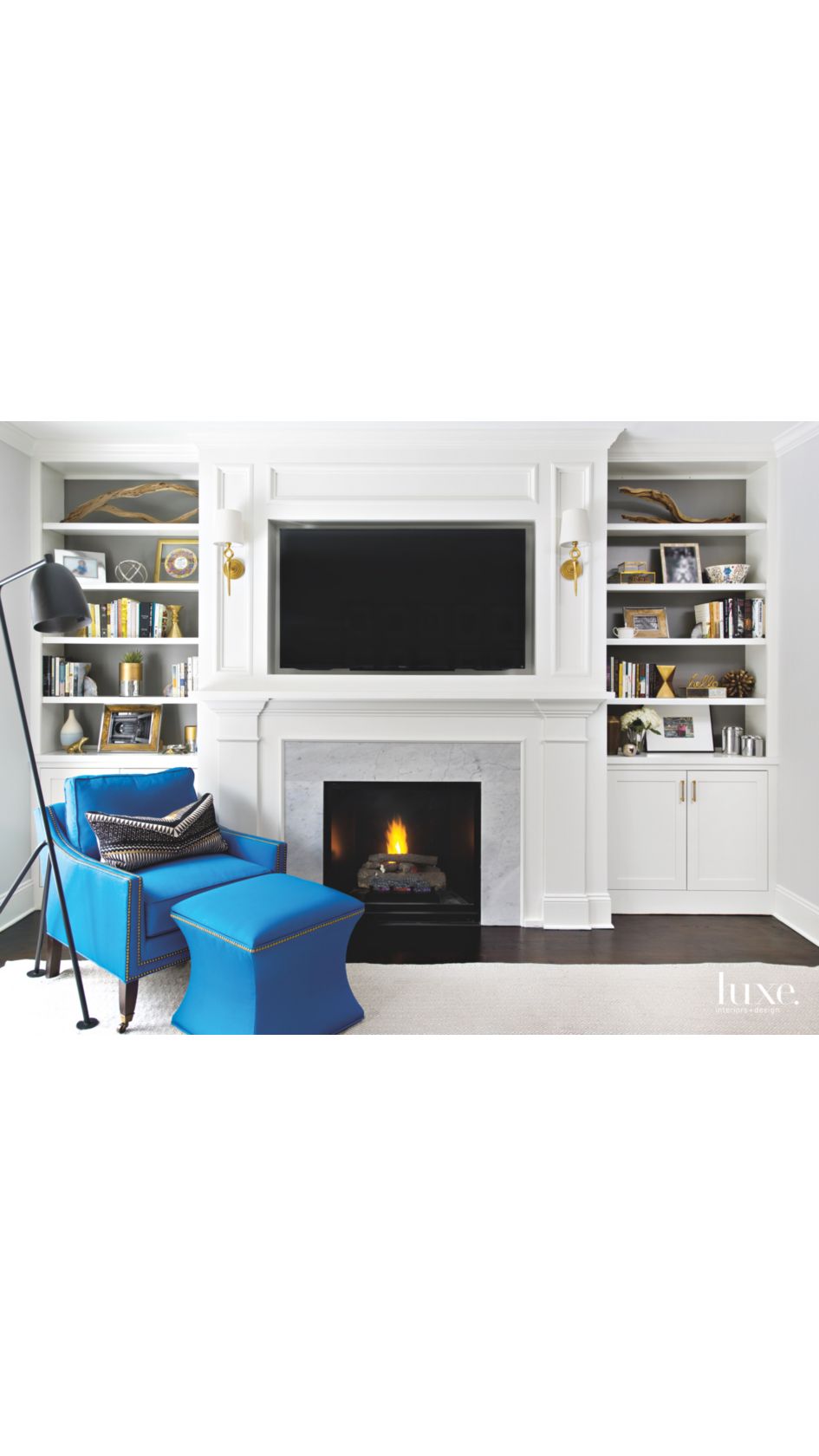 Built In Millwork Family Room With Blue Chair Ottoman