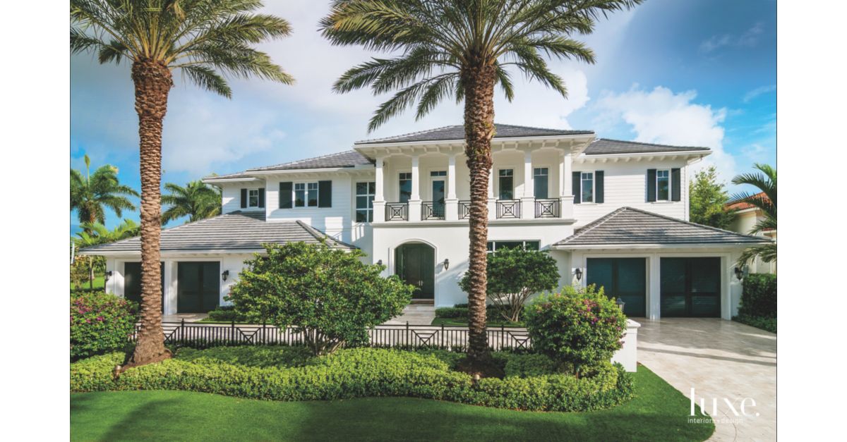 West Indies Style Home Exterior with Date Palm Tree Frame Luxe